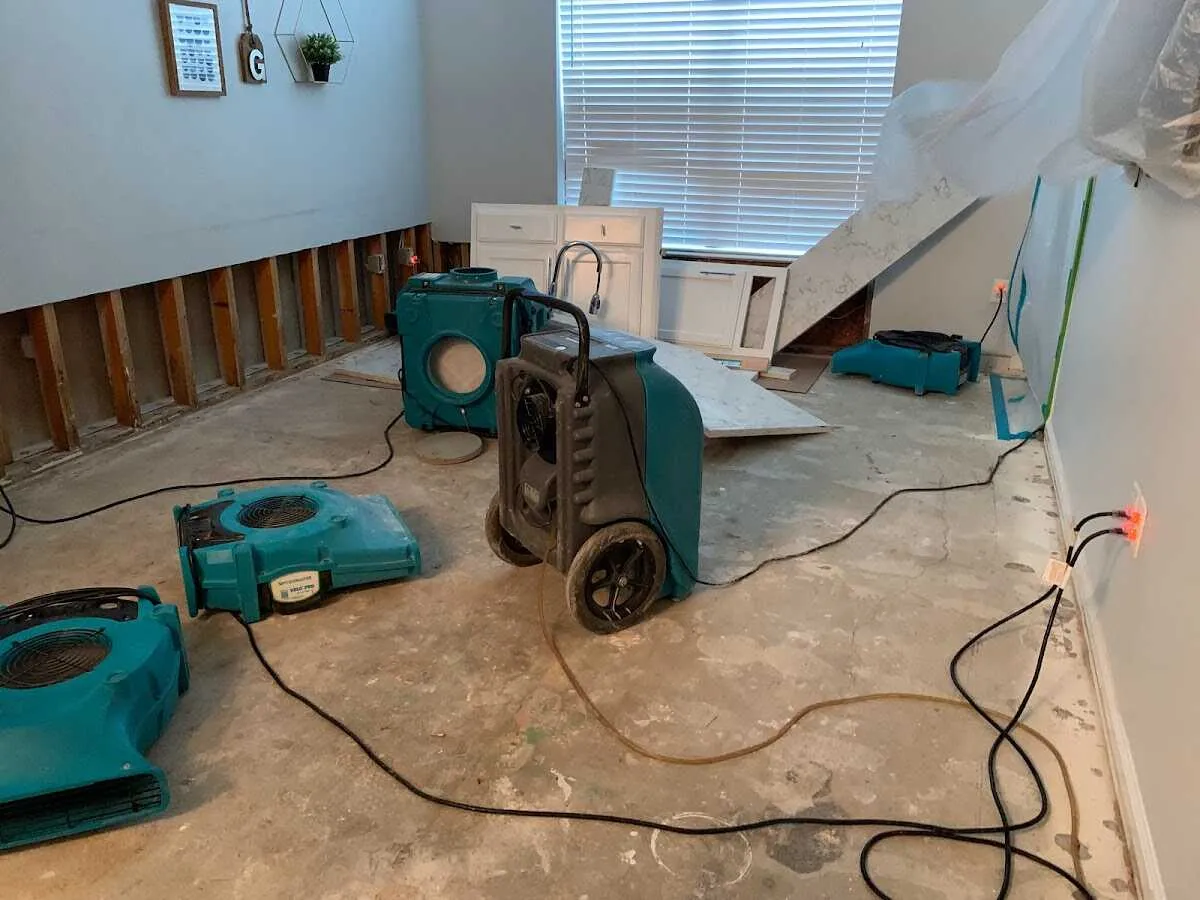 Dehumidifier in flood-cut room for Water Damage Restoration in West Loch Estate